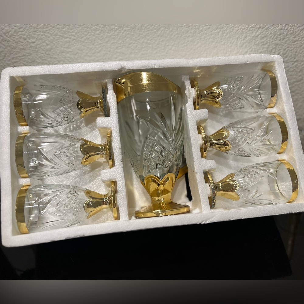 New Set Of Gold And Crystal Glasses And Jug
